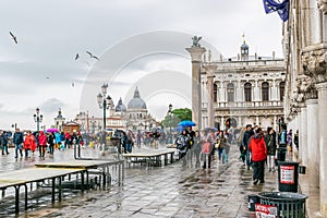 Rainy day in Piazza San Marco St Marks Square with Doges Palace on the right in Venice, Italy