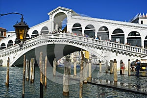 Venice, Italy, October 2021: Crowd of people standing along the famous Rialto Bridge.