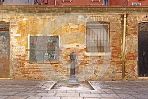 Venice, italy: old building and drinking fountain. travel photo