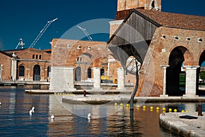 Venice, Italy. Old historic Arsenale port with art installation.