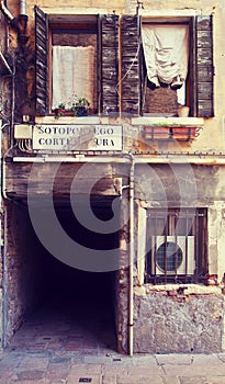 Venice, Italy - picturesque corner with dark pedestrian passage