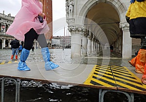 Venice in Italy and the raised walkway to walk during the high W