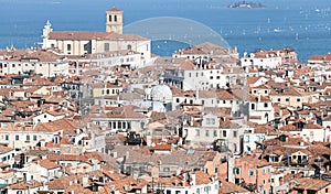 Venice, Italy, red-tiled roofs of the houses and the Church photo