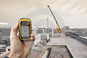 Venice, Italy - September 22, 2014: finding the right position inside a construction site via gps blurred background