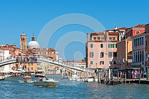 Venice, Italy - september 15, 2019: Panoramic view of the Grand Canal with vaporetto and tourists near Venice Santa Lucia station