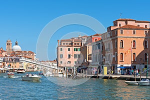 Venice, Italy - september 15, 2019: Panoramic view of the Grand Canal with vaporetto and tourists near Venice Santa Lucia station