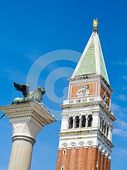 Venice, Italy, St. Mark`s Square Piazza San Marco detail of Column of the Lion and Bell Tower of Saint Mark