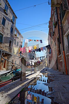 Venice Italy street with laundry washed clothes hanging out to dry