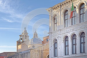 Venice, italy: traditional venice buildings. Italian flag