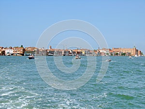 Venice. Italy. Unique Venetian views from the sea and land in the summer sunny day.