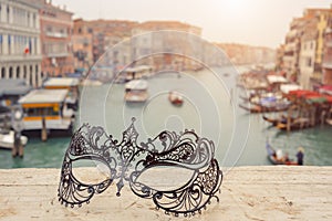 Venice, Italy .Venetian masks on bridge agaist landscape Grand Canal