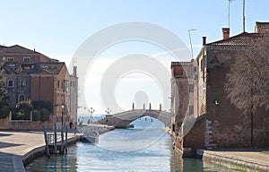 View of the bridge and Fondamenta Arsenale in Castello. Venice. photo