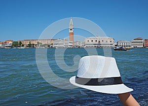 Venice, Italy. White hat with the background of Piazza San Marco and Riva degli Schiavoni