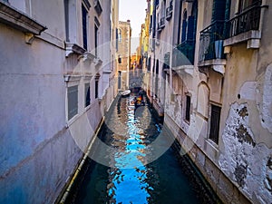 Venice, landscape showing a minor canal running alongside two buildings