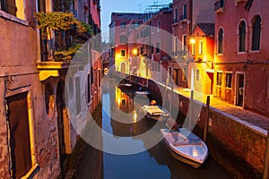 Venice at night. Boats in canal street houses in water. Venice cityscape, Italy