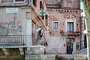 Venice panorama: canal, boats and old brick houses in Venice, Italy, Europe