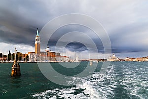 Venice panorama from the sea. San Giorgio Maggiore island view from water bus. Campanile Bell Tower, Church and