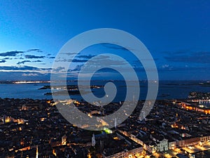 Venice panoramic cityscape landmark at sunset or night, aerial view of Piazza San Marco