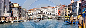 Venice Rialto bridge over Canal Grande with gondola travel traveling holidays vacation town panorama in Italy