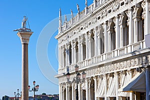 Venice, Saint Theodore statue and Marciana library facade in Italy photo