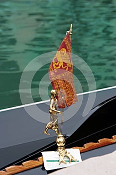 Venice symbol: citiy's flag decorating a gondola