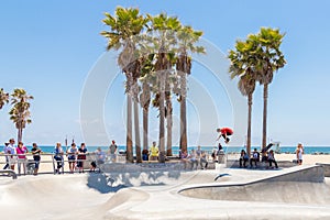 VENICE, UNITED STATES - MAY 21, 2015: Skater boy practicing at the skate park at Venice Beach, Los Angeles, California