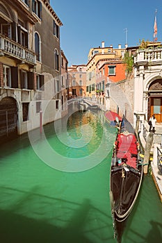 VENICE, VENETO, ITALY - Tourists, gondola riding, typical canal in Venice, September 21, 2017