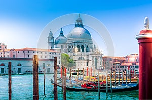 Venice view on church Basilica di Santa Maria della Salute and canal with gondolas