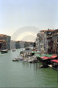 Venice, view of the city. Antique houses and piers with gondolas.