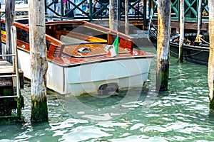 Venice Water Taxi Docked at Wooden Piers