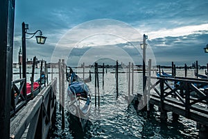 Venitian gondola at the pier waiting for costumers