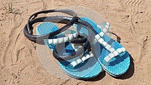 venomous black snake basks in the sun lying on a woman