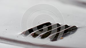 Vent hole with steam on the sheet metal Closeup view