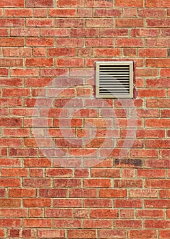 Vent on Weathered Brown Brick Wall, Vertical Pattern