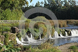 Ventas Rumba Waterfall and wooden bridges on the Venta river. Kuldiga, Latvia