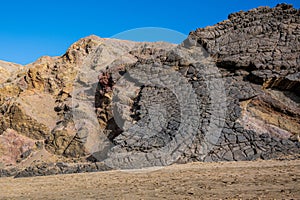 Ventifact rock formations caused by wind at La Pared Beach, Fuerteventura