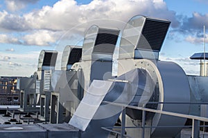Ventilation and air conditioning system installed on the roof of an office building, galvanized elements of air ducts