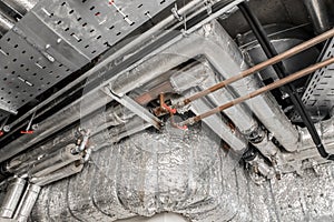 Ventilation air conditioning system in thermal insulation material duct pipe hvac pipeline on the ceiling of an industrial plant