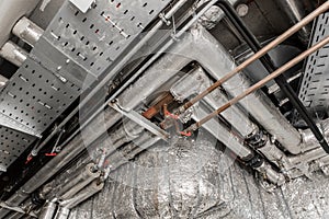 Ventilation air conditioning system in thermal insulation material duct pipe hvac pipeline on the ceiling of an industrial plant