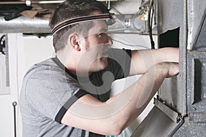 Ventilation cleaner man at work with tool