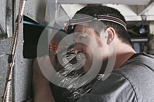 Ventilation cleaner man at work with tool