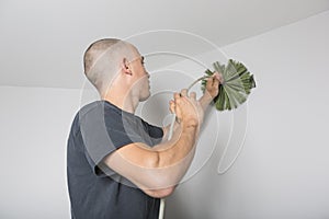 Ventilation cleaner man at work with tool