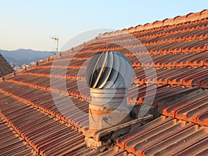 Ventilation Metal Chimney on Shingle Roof with View