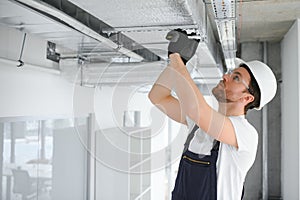 ventilation system installation and repair service. hvac technician at work. banner copy space
