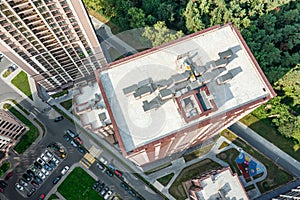 Ventilation systems on the roof of high-rise residential building. aerial top view