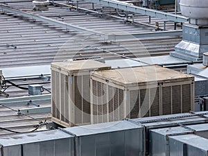 Venting and air conditioning units up on top of industrial roof line