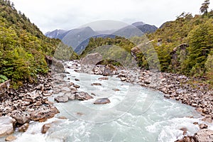 Ventisquero River on trail to Glacier, near the village of Puyuhuapi, Chile. photo