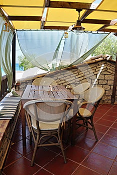 Veranda with drapes and sea view