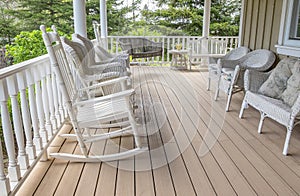 Veranda Filled with White Wicker Furniture