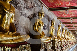 Veranda of Gild Buddha Sculptures at Wat Suthat, Bangkok of Thailand. photo